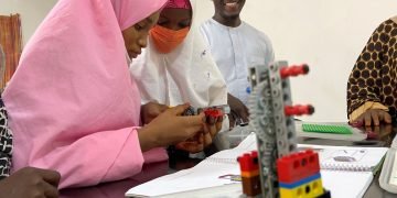 Teenage girls doing robotics